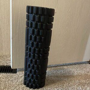 a black  workout foam roller
